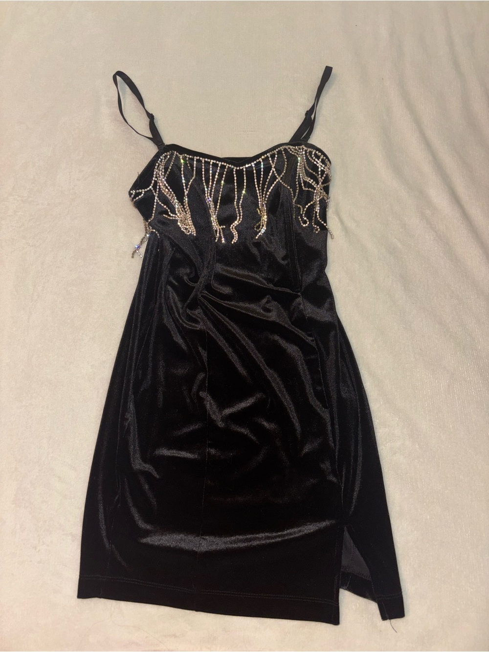 woman’s black velvet dress